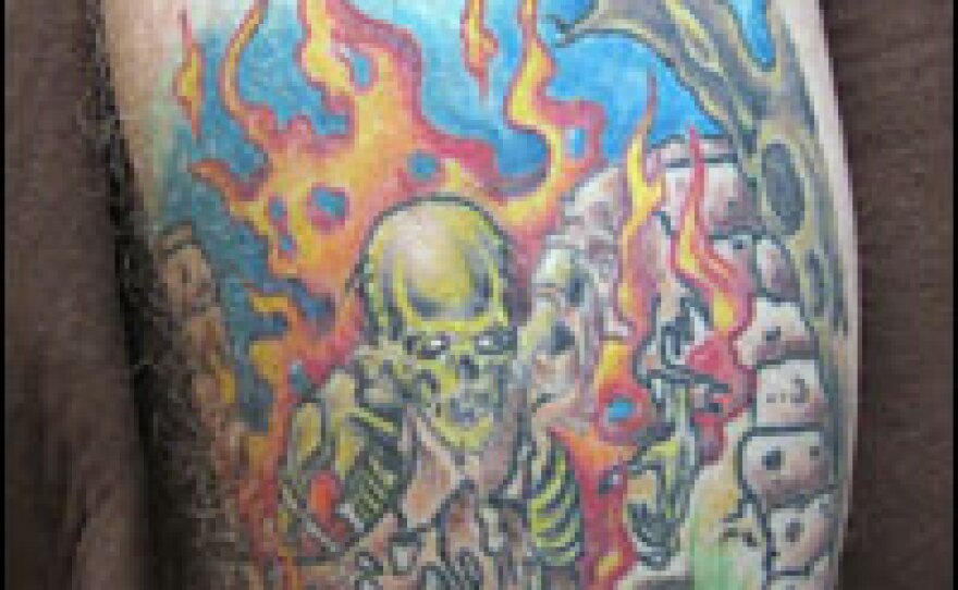 Brumley calls this his "therapy tattoo." He says the image is of the Taliban fighter who attacked him in Afghanistan. "It looks like he is being pulled into hell," Brumley says.