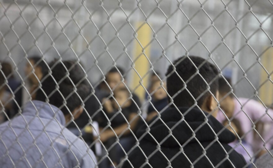 U.S. Border Patrol agents conduct intake at the Central Processing Center in McAllen, Texas. The center is temporarily not taking in migrants after the outbreak of "a flu-related illness."