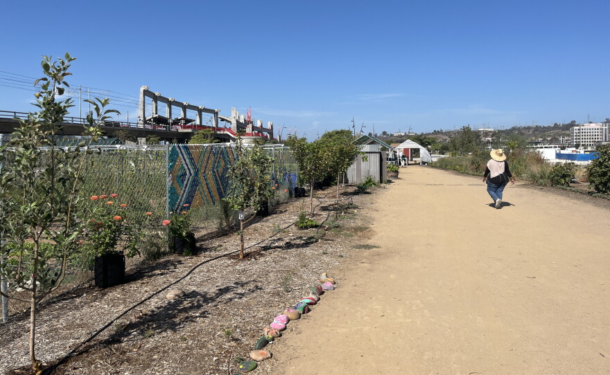 Make Projects program assistant Zahra Ahmed walks along a dirt pathway at Make Farms in SDSU Mission Valley, Aug. 21, 2026.