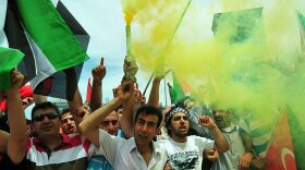 Turkish demonstrators wave Palestinian flags and shout slogans during an anti-Israeli protest Monday on Taksim Square in Istanbul.