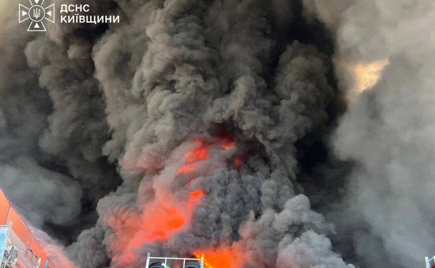 In this photo provided by the Ukrainian Emergency Service, firefighters put out a fire in a warehouse following a Russian drone attack near Kyiv, Ukraine on Saturday.