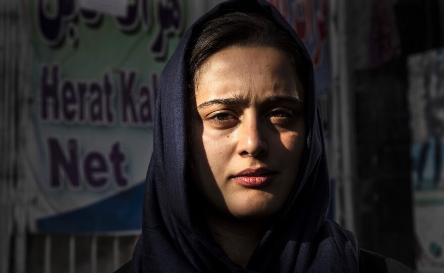 Dawlatt Naimati, 22, from Kunduz, stands outside an internet café where she is seeking help applying for a U.S. special immigrant visa on Aug. 8, in Kabul, Afghanistan.