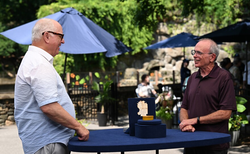 Ken Farmer (left) appraises a Shaker-signed box with note, ca. 1850, in Baltimore, Md. ANTIQUES ROADSHOW “Maryland Zoo, Hour 3” airs Monday, April 28 at 8/7C PM on PBS.