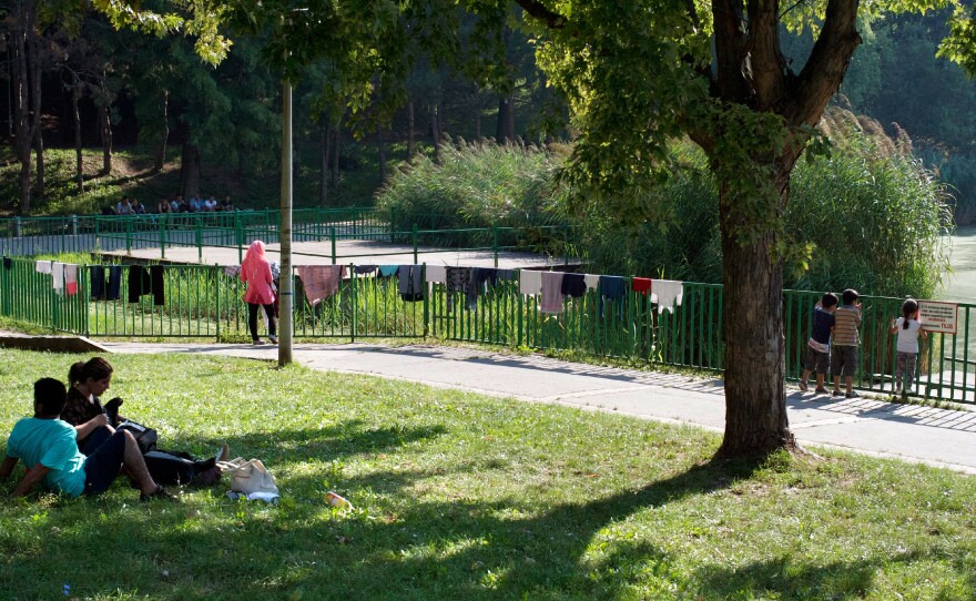 Clothes dry on the side of a fence at a city park in Budapest where Syrians camped out. Most hotels and hostels don't rent rooms to refugees and migrants.