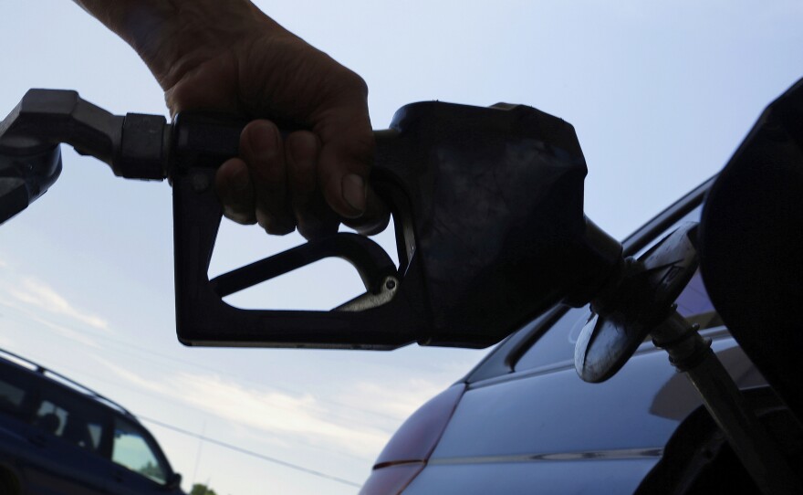 A motorist fuels up at a service station in Springfield, Ill.