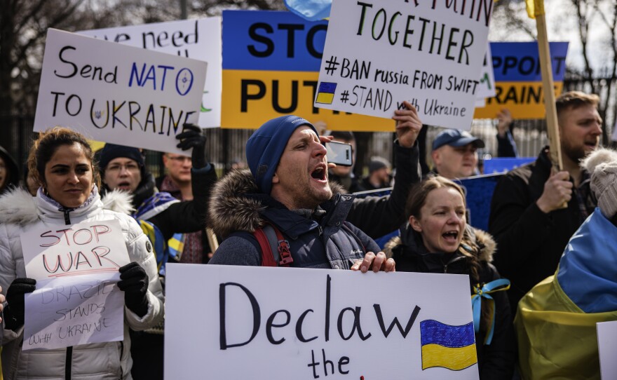 People participate in a pro-Ukrainian demonstration in front of the White House on Saturday in Washington, D.C.