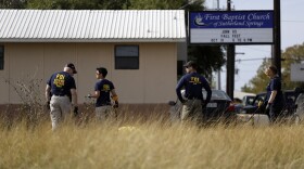 Law enforcement officials investigate the scene of a shooting at the First Baptist Church of Sutherland Springs, Monday, Nov. 6, 2017. 