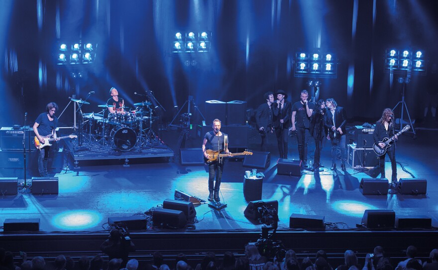 Sting (center), with band and vocalists, at the Olympia Paris in April 13, 2017.