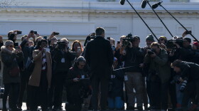 Then-CNN White House correspondent Jim Acosta talks with reporters as he returns to the White House after his press pass was restored on Nov. 16, 2018, in Washington.