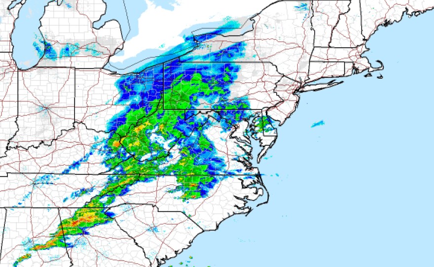 The National Weather Service radar image provided by NOAA shows a storm system moving across the U.S. late Wednesday. A densely populated swath of the Northeast was preparing for winter's harshest thump yet, a fast-moving storm that could bring more than a foot of snow, strong winds and coastal flooding.