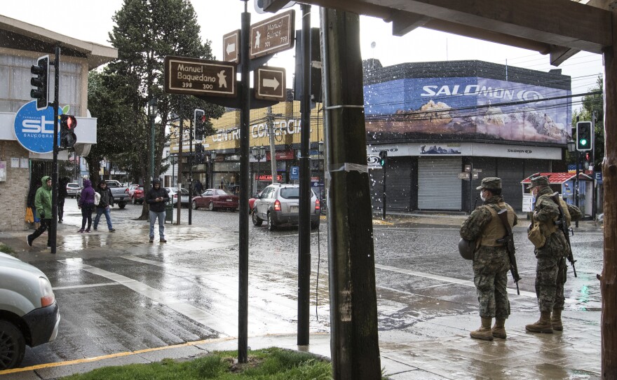 Puerto Natales, the gateway town to Torres del Paine National Park, is typically brimming with adventure-seeking tourists. Now, most stores are closed, and military police patrol the streets.