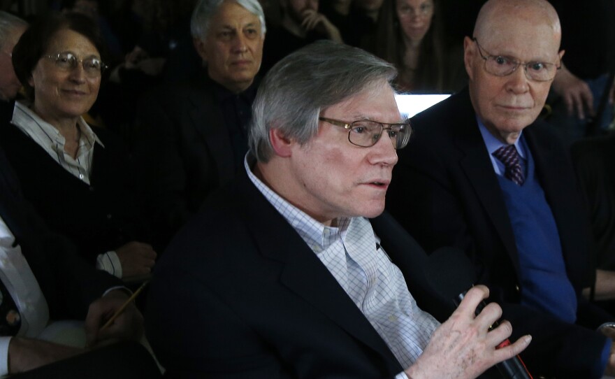 Physicist Alan Guth of the Massachusetts Institute of Technology asks a question during a news conference at the Harvard-Smithsonian Center for Astrophysics in Cambridge, Mass., on March 17, 2014, after researchers gave a presentation about their new findings on the early expansion of the universe.