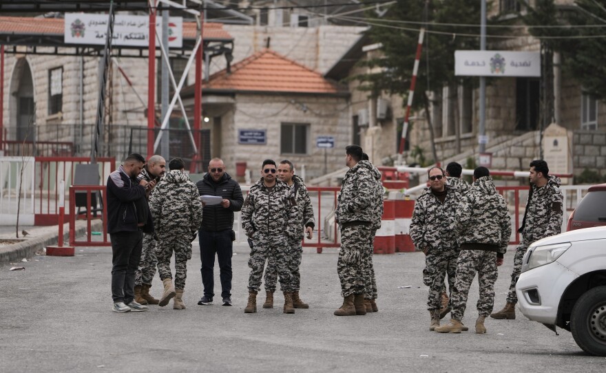 Members of Lebanon's General Security stand at the Masnaa border crossing in the Bekaa valley, eastern Lebanon, Sunday, April 5, 2026.