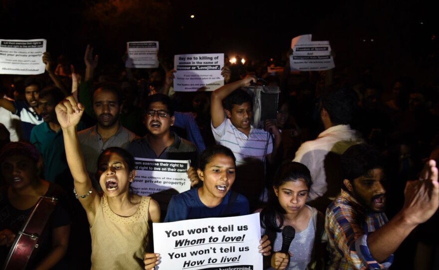 Members of Jawaharlal Nehru University Students' Union march against the screening of the film <em>In the Name of Love - Melancholy of God's Own Country</em>, in New Delhi, on April 28, 2018. The protesters accused the film of spreading hate through the conspiracy theory known as "love jihad."