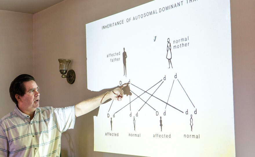 John Ringman, a neurologist at the University of Southern California, describes inheritance of genetic disease to John and Jay Kitchen's family in Riverside, Calif. Ringman has devoted much of his career to studying families with a mutation linked to early-onset Alzheimer's.