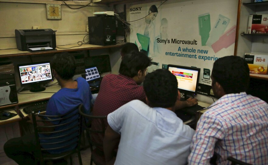 Indian youths use the Internet at a cyber cafe in Allahabad, India, Monday. India ordered Internet service providers to block access to more than 850 adult websites in what the government has described as a way to protect social decency. But after an outcry on social media, the government reversed itself on Wednesday.