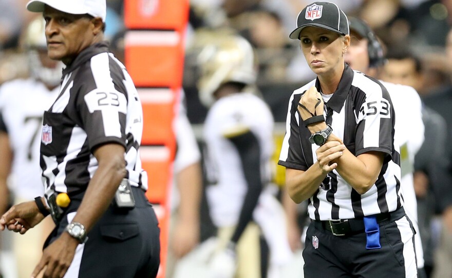 Sarah Thomas calls holding during the preseason game between the Oakland Raiders and New Orleans Saints in August of 2013.