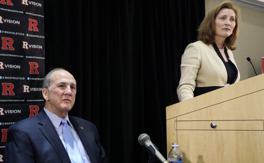 Rutgers athletics director Julie Hermann takes a question as university President Robert Barchi looks on Wednesday. Hermann' hire comes a month after the school fired its basketball coach over a video of abusive practices.