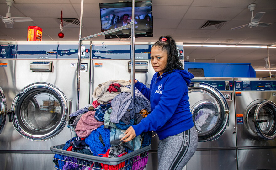 Nelly Villanueva washes her clothes in 2019.