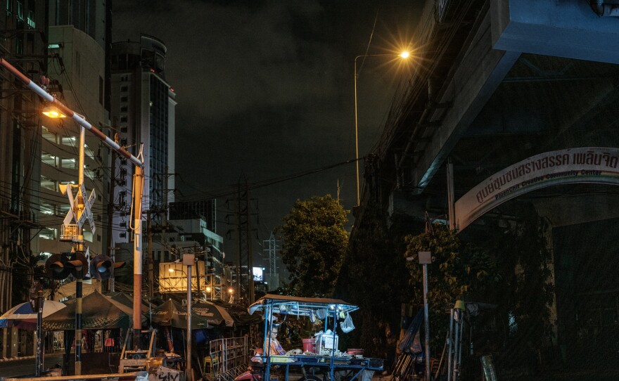 One of Bangkok's street vendors and his bicycle worker. So-called "informal workers" have suffered the loss of income in the wake of coronavirus lockdown measures.