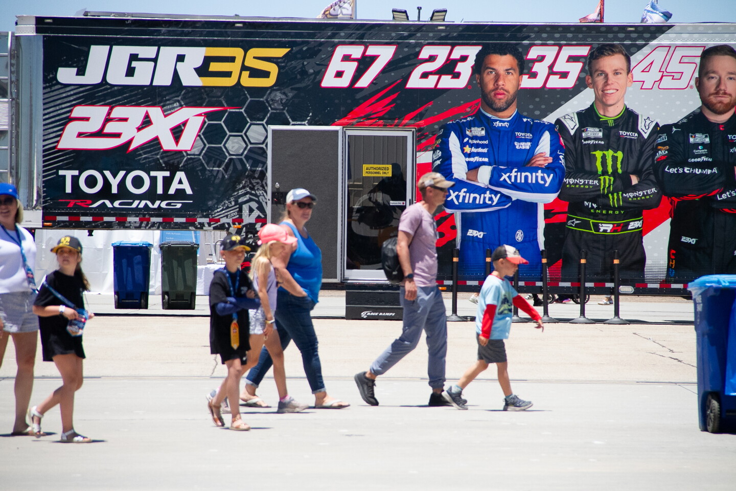 Visitors walk around the NASCAR San Diego Weekend presented by Anduril at Naval Base Coronado