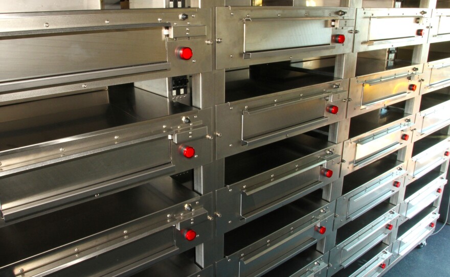 The racks lock into place so the ovens stay still while the delivery truck is being driven.