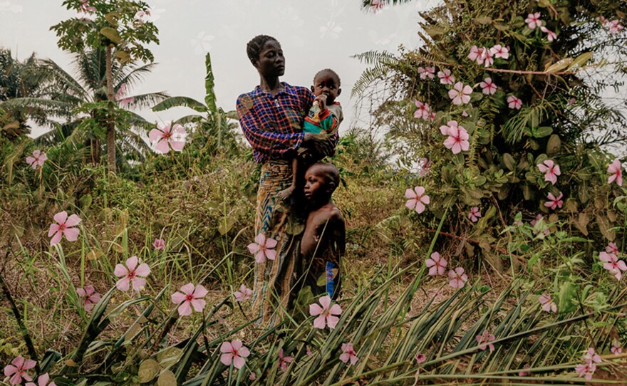 A mother and her two children in the Kasaï province of the Democratic Republic of Congo. The province is still reeling from years of violent conflict. In his caption, photographer Hugh Kinsella Cunningham said he used double exposures to underscore the "tension of life for mothers in Kasaï, living in beautiful land, but unable to provide for their families."<strong> </strong>