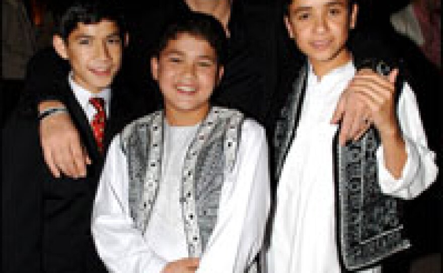 <em>The Kite Runner</em>'s 12-year-old star Zakria Ebrahimi (center) had to be relocated from Kabul, Afghanistan, to Dubai because of harassment about his character in the movie.