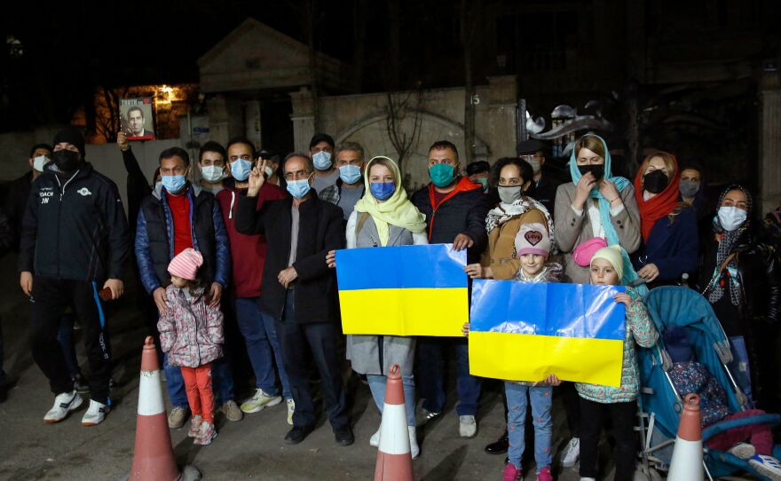 Iranians and Ukrainian nationals rally in front of the Ukraine embassy in Tehran on Saturday to show support for Kyiv and protest the Russian invasion.