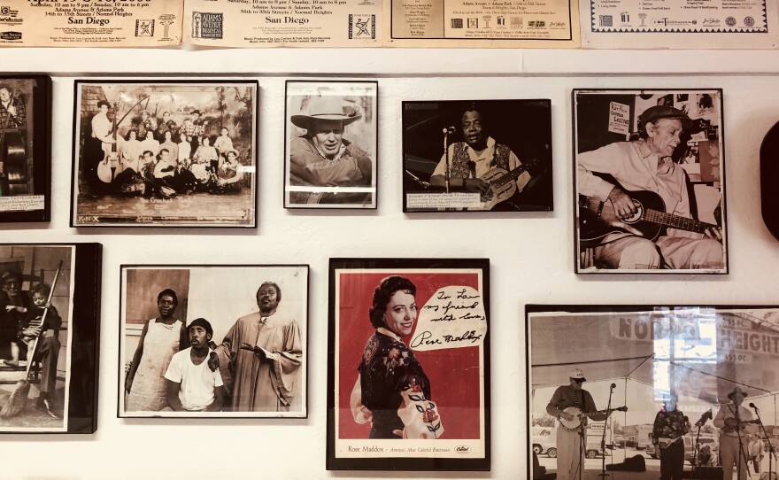 Memorabilia and photos Lou Curtiss collected, including a signed photograph of Rose Maddox, center, hangs in Folk Arts Rare Records, Oct. 31, 2018. |