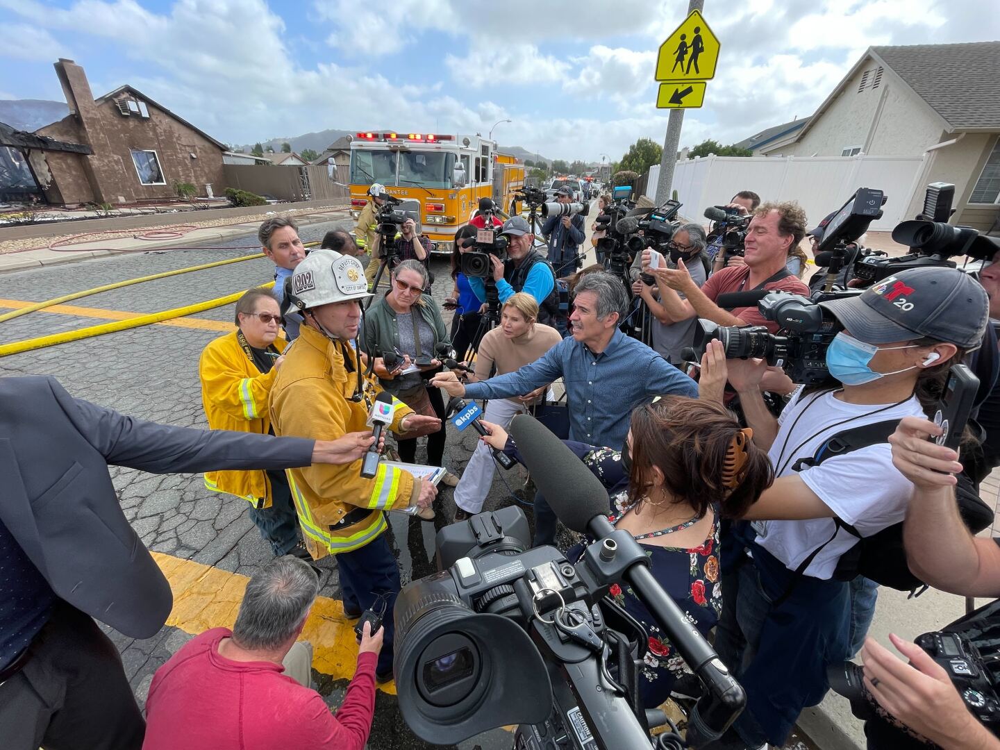 Reporters surround first responders at the scene of a plane crash in Santee, Calif. Oct. 11, 2021.