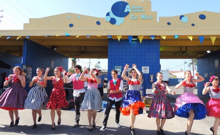 A photo of San Diego Junior Theatre performing at Art Around Adams.