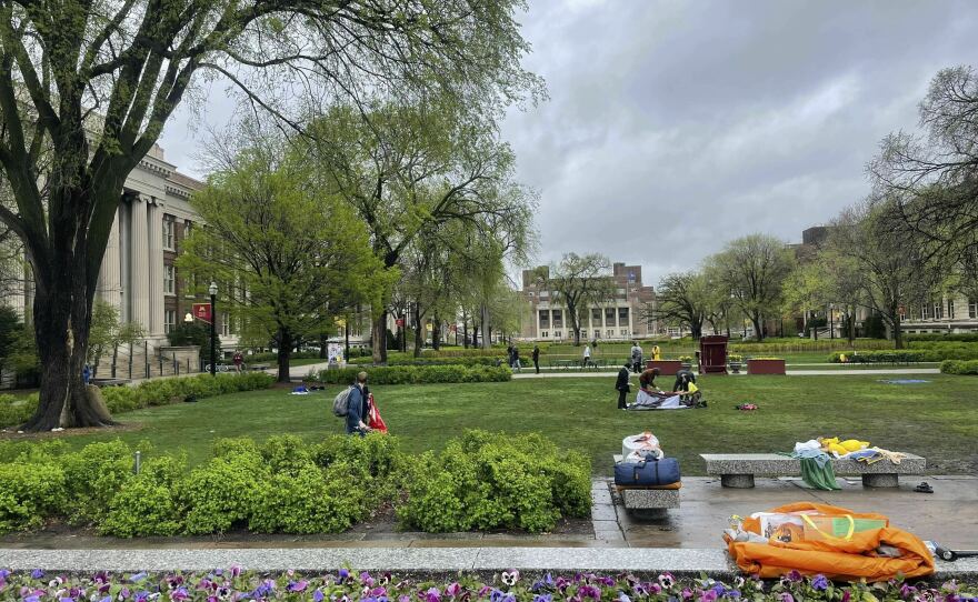 People take down the pro-Palestinian encampment at the University of Minnesota in Minneapolis, Minn., on Thursday.