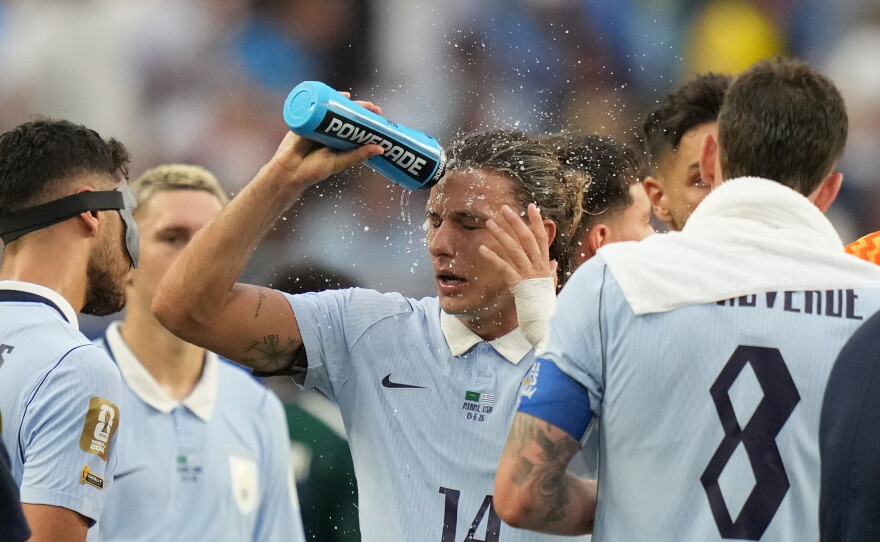 Uruguay's Agustin Canobbio cools off during a hydration break in a World Cup soccer match against Saudi Arabia in Miami Gardens, Fla., on June 15, 2026. Dangerously hot, humid weather in the area prompted an extreme heat warning from the National Weather Service earlier in the day.