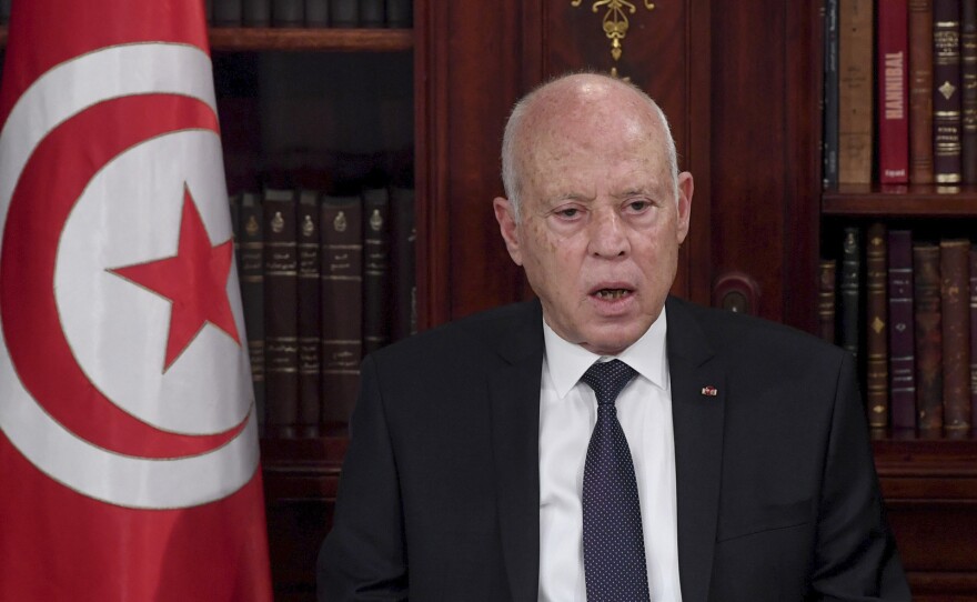 Tunisia's President Kais Saied leads a security meeting with members of the army and police forces in Tunis, Tunisia, on Sunday. Troops surrounded the parliament building and blocked its speaker Rached Ghannouchi from entering Monday after the president suspended the legislature and fired the prime minister following nationwide protests.