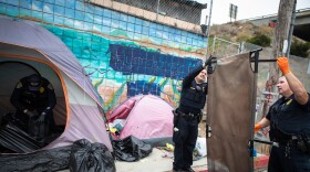 San Diego police impound the belongings of a person who was detained by police for having an outstanding warrant, San Diego, Calif. June 9, 2022.