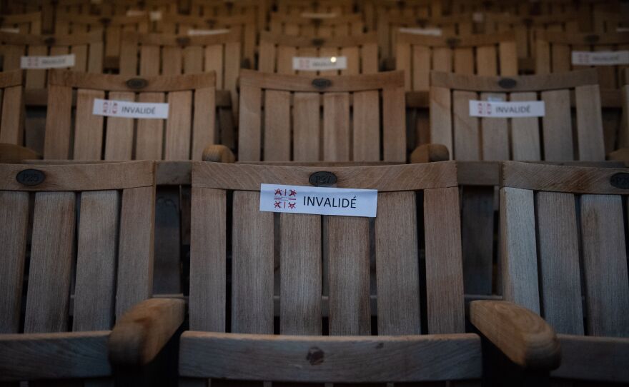 A photo shows seats with stickers to respect social distancing due to the COVID-19 pandemic, in the Theatre de l'Archeveche in Aix-en-Provence, southern France, on July 23, 2020.