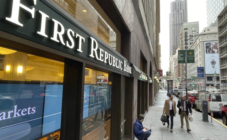 People walk past the headquarters of First Republic Bank in San Francisco, Monday, May 1, 2023.