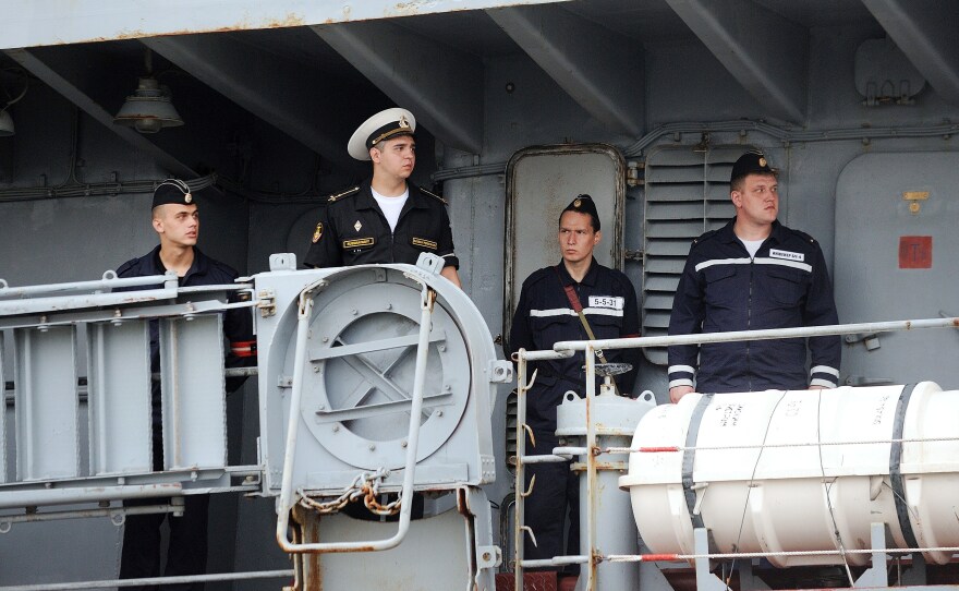 Russian sailors arrive in St. Nazaire aboard the Smolniy on June 30. They are among the 400 Russian sailors who will train on the Vladivostok — and sail the ship back to Russia.