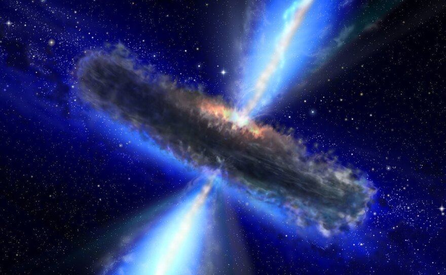 This artist's impression shows the dust torus around a super-massive black hole. Black holes lurk at the centers of active galaxies. The jets emanating from the black hole send neutrinos hurtling into space.
