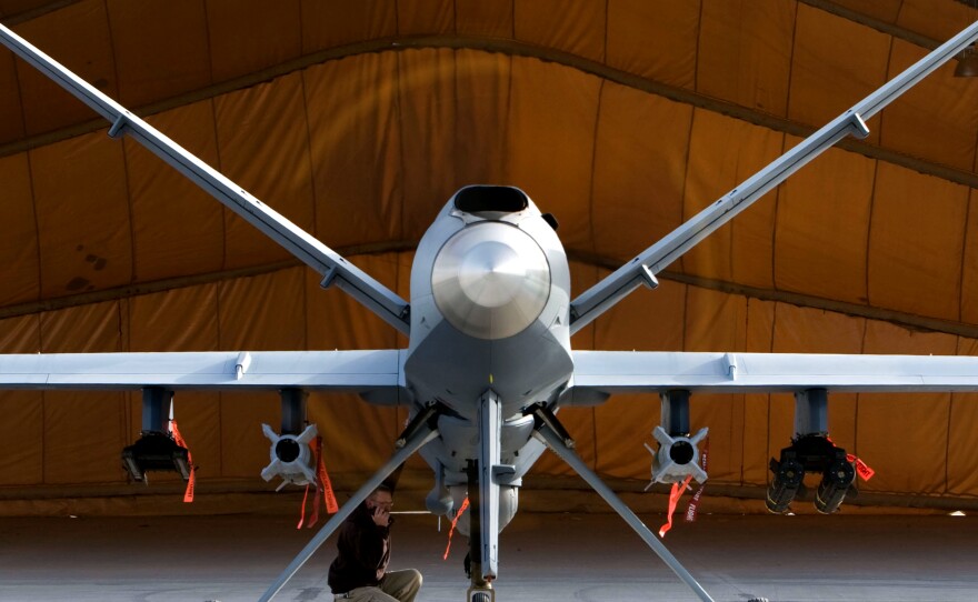 A maintenance airman inspects an MQ-9 Reaper, a high-speed, high-altitude drone, in Afghanistan. National Guard units are beginning to pilot these unmanned aircraft that can conduct intelligence, surveillance and reconnaissance missions.