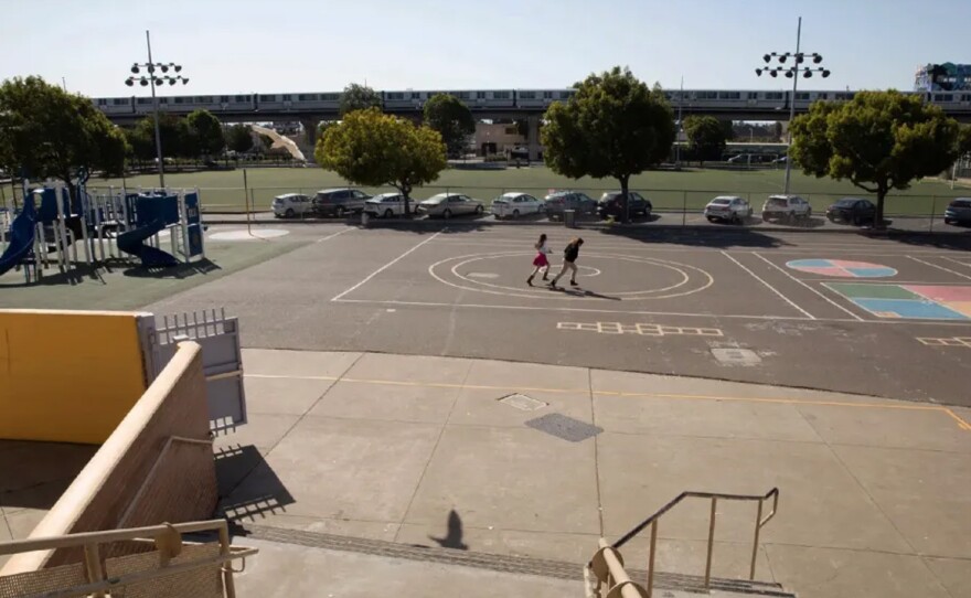 This undated photo shows the schoolyard at the César E. Chávez Education Center in Oakland, prior to the creation of a ‘living schoolyard’. Advocates say most of California’s public schools lack trees or other outdoor shade sources, leaving millions of students vulnerable to heat and sun. 