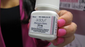 Sprout Pharmaceuticals CEO Cindy Whitehead holds a bottle for the female sex-drive drug Addyi at her Raleigh, N.C., office on Tuesday, Aug. 15, 2015. 