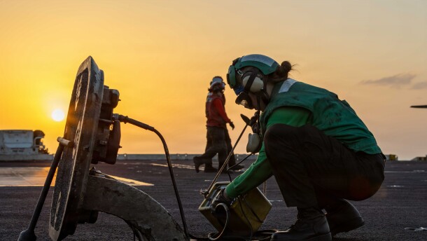 A sailor conducts maintenance on catapult communications on the flight deck of the San Diego-based aircraft carrier USS Abraham Lincoln during Operation Epic Fury, April 2, 2026.