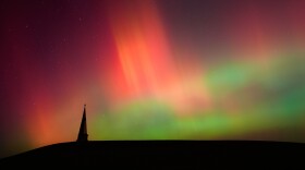 FILE - Northern lights fill the sky behind the Saint Joseph the Woodworker Shrine, near Valley Falls, Kan., Nov. 11, 2025.