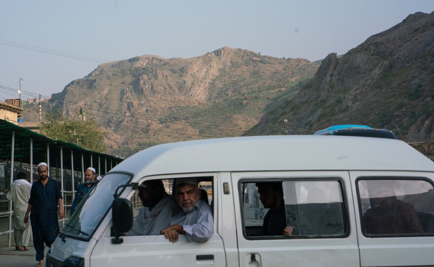 A Pakistani minibus arrives to transport people to and from the border.