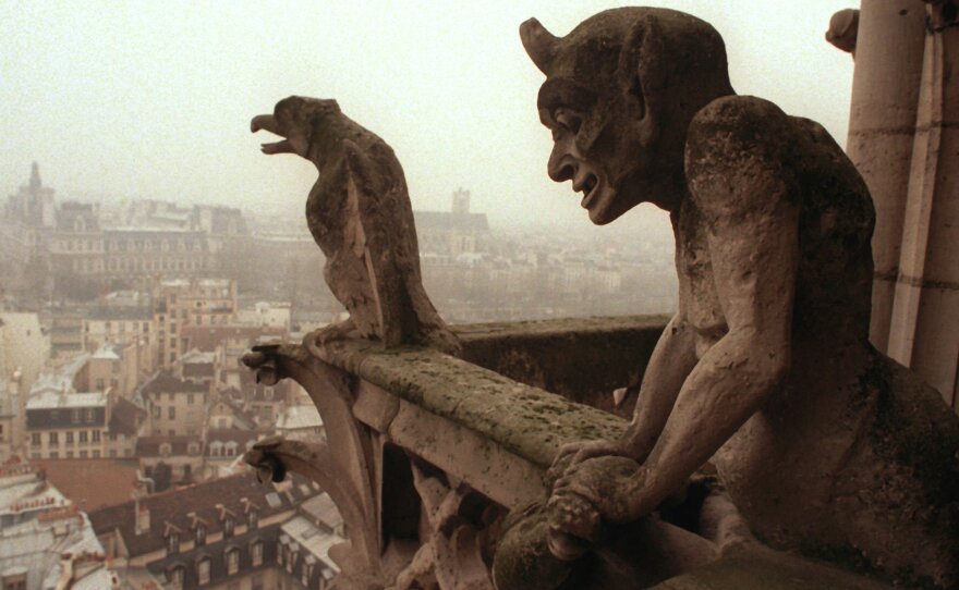 Gargoyles watch over the streets of Paris from the top of the Notre Dame Cathedral in 1996.