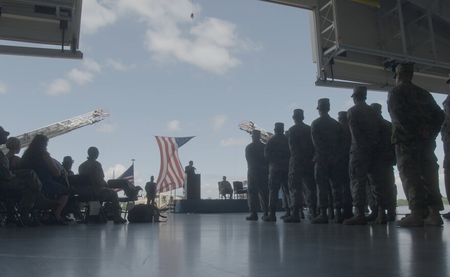 Soldiers stand at attention at a welcome-home ceremony for the Delaware National Guard.