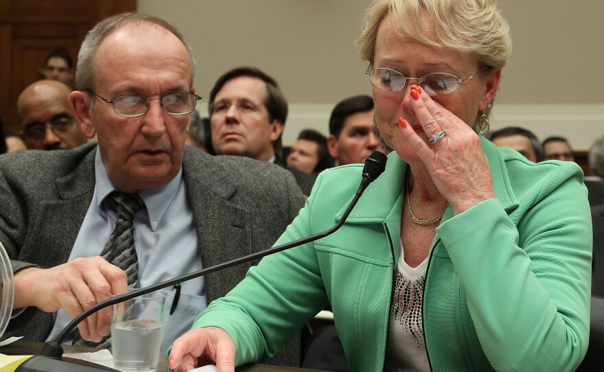 Eddie Smith (L) and Rhonda Smith (R) of Sevierville, Tennessee testify about her gas pedal sticking while James Lentz (C) president and COO of Toyota Motor Sales, U.S.A., Inc. listens during a House Energy and Commerce Committee hearing on Capitol Hill on February 23, 2010 in Washington, DC. 