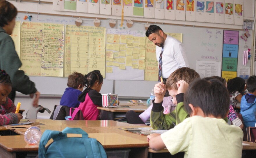 Principal Daniel Rolleri helps out in class at Sacramento's Oak Ridge Elementary.